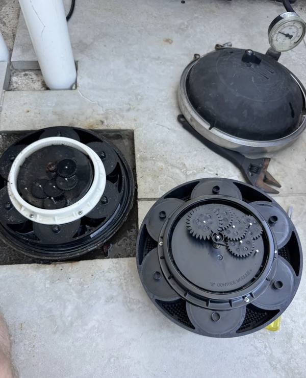 Valve module pulled out showing gears and diaphragms