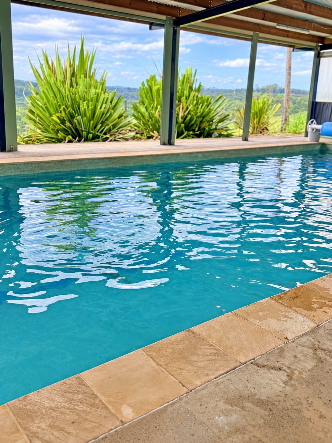 Covered outdoor pool with countryside views